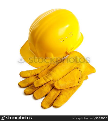 yellow hardhat and working gloves isolated on white background, selective focus