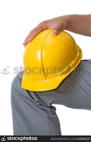 Yellow helmet at man hands isolated on a white