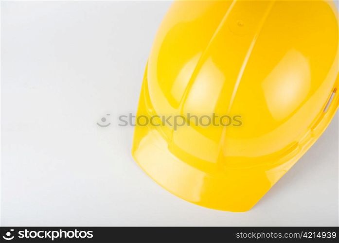 Yellow helmet closeup on a white background