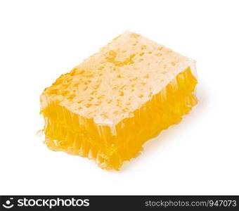 Yellow Honeycomb slice closeup isolated on white background. Honeycomb slice