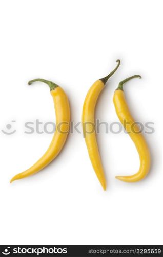 Yellow hot peppers on white background
