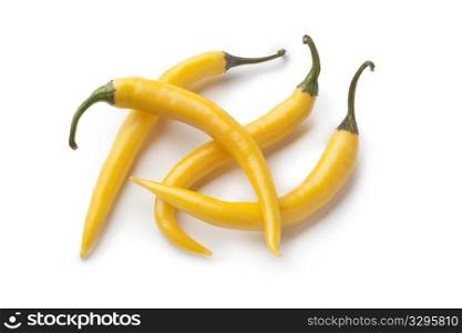 Yellow hot peppers on white background