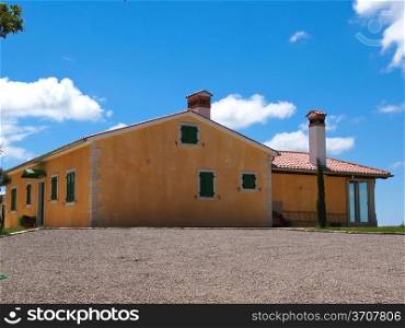 yellow house and blue sky