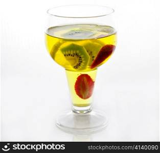 yellow jello in a glass , close up