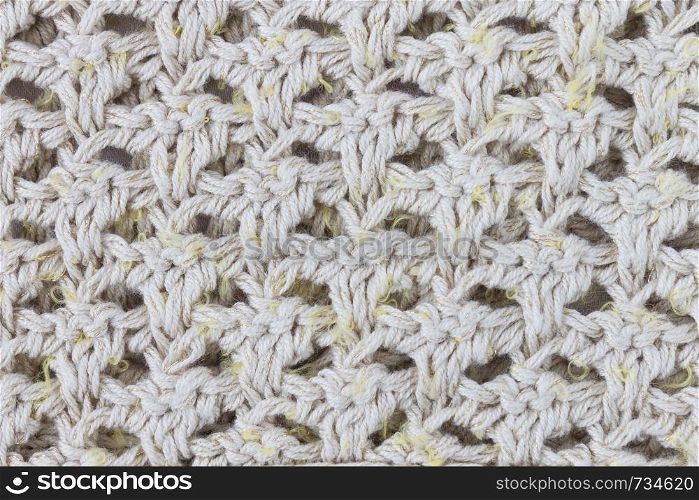 Yellow Knitting Texture or Knitted Texture Background in macro style. Knitting Texture or Knitted Texture in vintage style for design