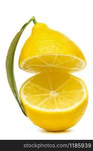 yellow lemon cut into two parts with a leaf isolated on a white background