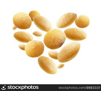 Yellow lentils in the shape of a heart on a white background.. Yellow lentils in the shape of a heart on a white background