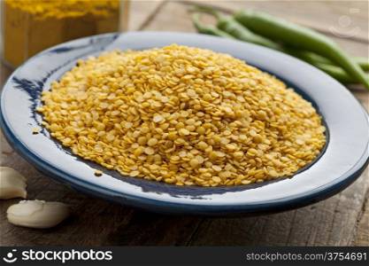Yellow lentils on a blue dish
