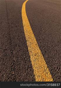 Yellow line painted on tarmac