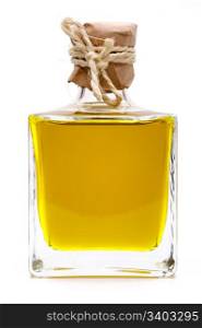 Yellow liquid, olive oil, in a bottle. Yellow liquid, olive oil, in a small glass bottle, traditional rustic style