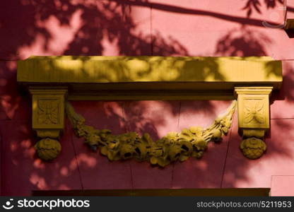 yellow marble top of door and a pink wall in la boca buenos aires argentina