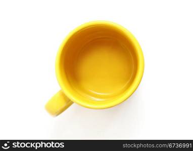 yellow mug isolated on white background, the top view