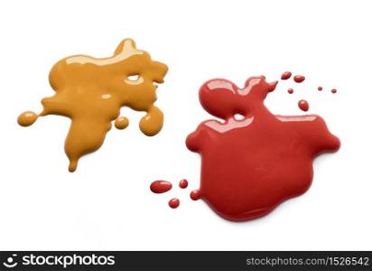 Yellow mustard and dark red ketchup splatter on white background. Mustard and ketchup splash