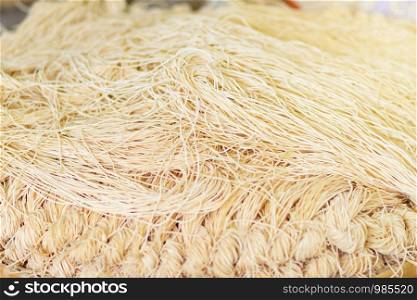Yellow noodles or Mee Sua food drying in the sunlight Making sun dried in Thailand are Chinese noodle vegetable in vegetarian festival.