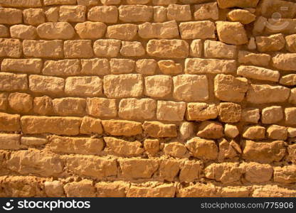 Yellow old grunge brick wall in yellow colors Stone Vintage Texture Background horisontal position