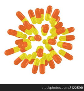 Yellow-orange pills exploding on the white background