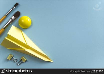 yellow paintbrushes paper plane inspiration