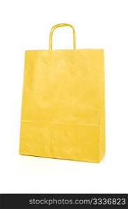 Yellow paper bag isolated on white background.