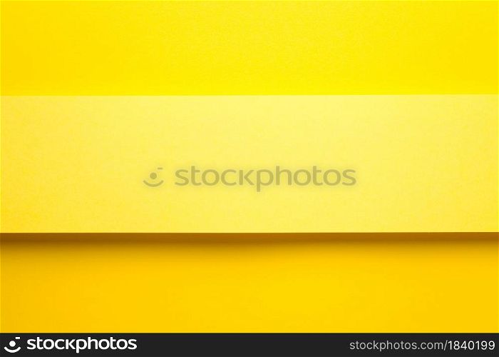 Yellow paper banner on yellow paper background. Top view. Copy space. Flat lay. Yellow Paper Banner On Yellow Paper Background
