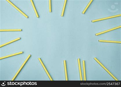 yellow paper straws flat lay