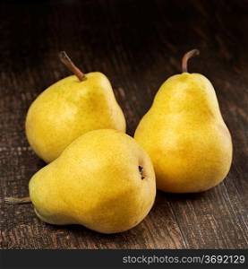 Yellow Pears On Wooden Background
