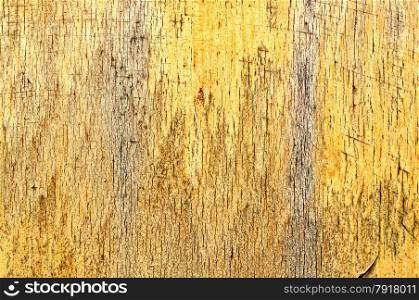 Yellow Peeled Paint on a wooden board.