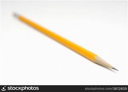 Yellow pencil on white background