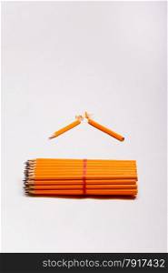 yellow pencils and a broken pencil