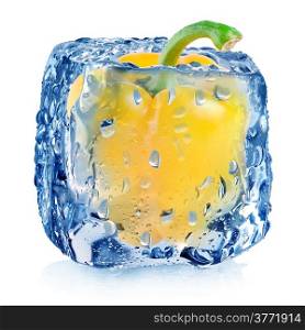 Yellow pepper in ice cube with drops isolated on white