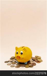 yellow piggy bank with stack coins