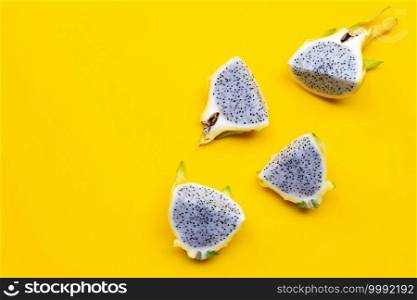 Yellow pitahaya or dragon fruit on yellow background. Copy space