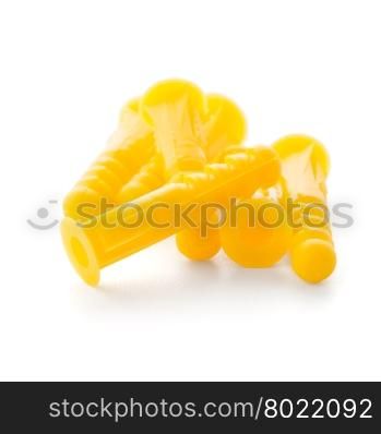 Yellow plastic dowels isolated on white background.