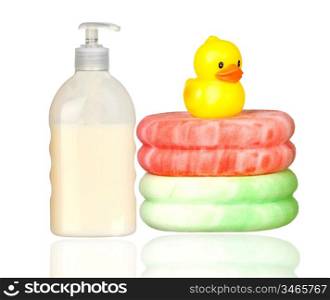 Yellow plastic duck over sponges and boat bath dispenser isolated on a over white background