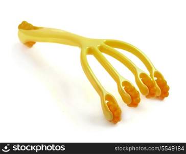 Yellow plastic hand massager isolated on white