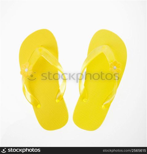 Yellow plastic thong sandals.