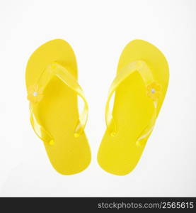 Yellow plastic thong sandals.