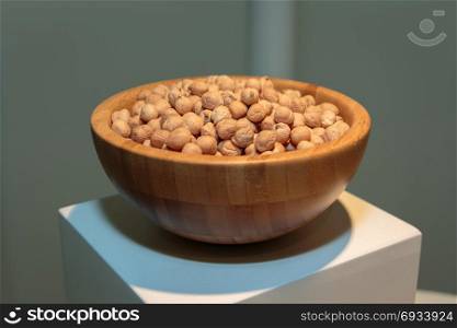 Yellow Raw Chickpeas inside Wooden Bowl