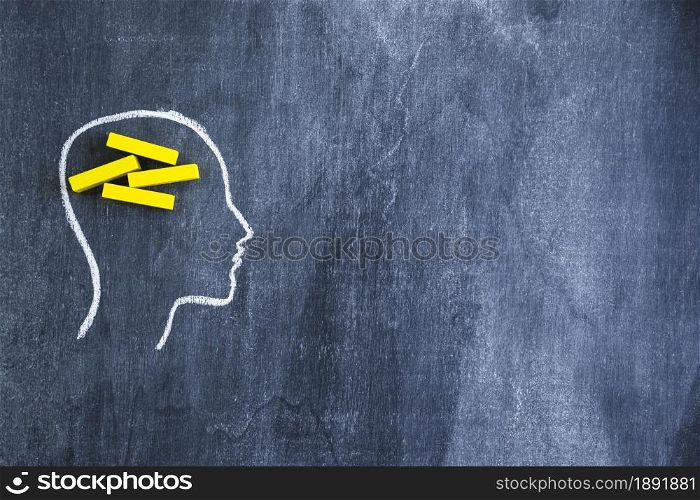 yellow rectangular wooden box drawn face outline with chalk blackboard. Resolution and high quality beautiful photo. yellow rectangular wooden box drawn face outline with chalk blackboard. High quality and resolution beautiful photo concept