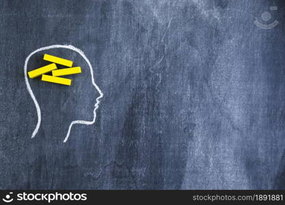 yellow rectangular wooden box drawn face outline with chalk blackboard. Resolution and high quality beautiful photo. yellow rectangular wooden box drawn face outline with chalk blackboard. High quality and resolution beautiful photo concept