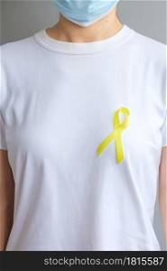 Yellow Ribbon for supporting people living and illness. September Suicide prevention day, Childhood, Sarcoma and bone cancer awareness month concept