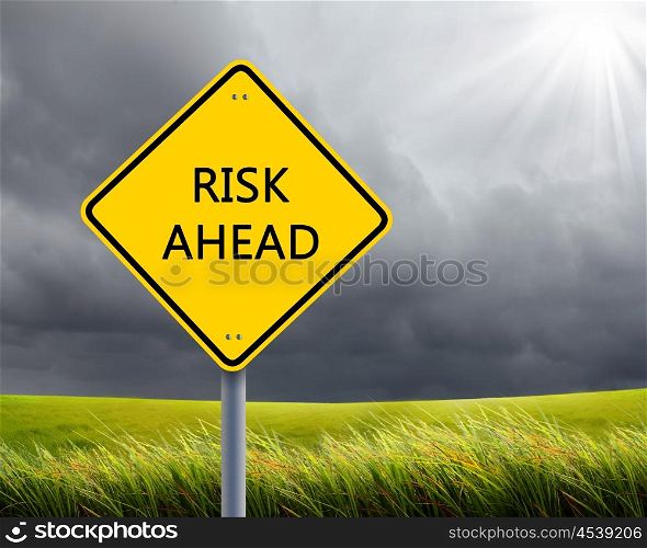 yellow road sign as a warning of risk ahead