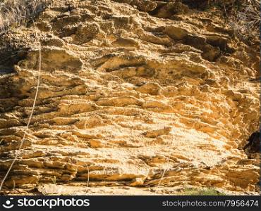 yellow rock sediments. Stratification of yellow stone