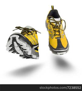 Yellow running sport shoes seen front, isolated on white background
