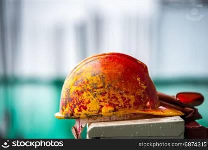 yellow safety hard helmet in construction site