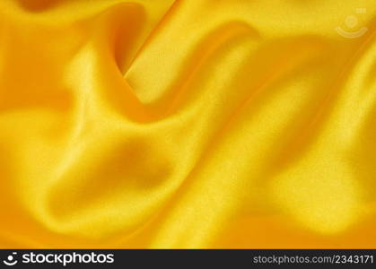 Yellow satin or silk fabric as background