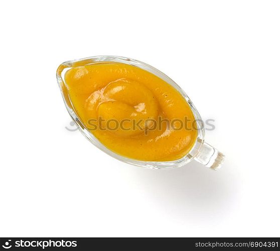 yellow sauce in bowl isolated on white background