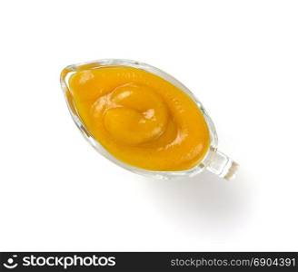 yellow sauce in bowl isolated on white background