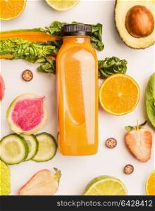 Yellow smoothie bottle with healthy fruits and vegetables ingredients on white desk background, top view, flat lay, vertical. Healthy clean and detox, weight loss dieting or fasting food concept