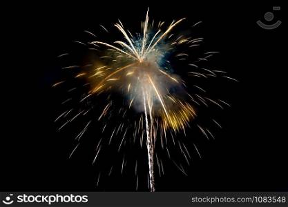 Yellow Sparkling Fireworks Background on Night Scene. Abstract color fireworks background and smoke on sky