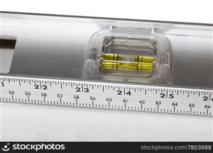 Yellow spirit level in aluminum measuring ruler in inches and cm